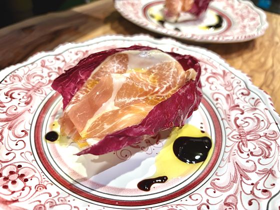 Radicchio, pear and prosciutto, served as a salad