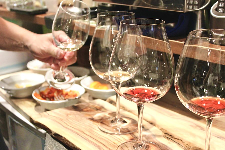 Comparing glasses of wine alongside the food
